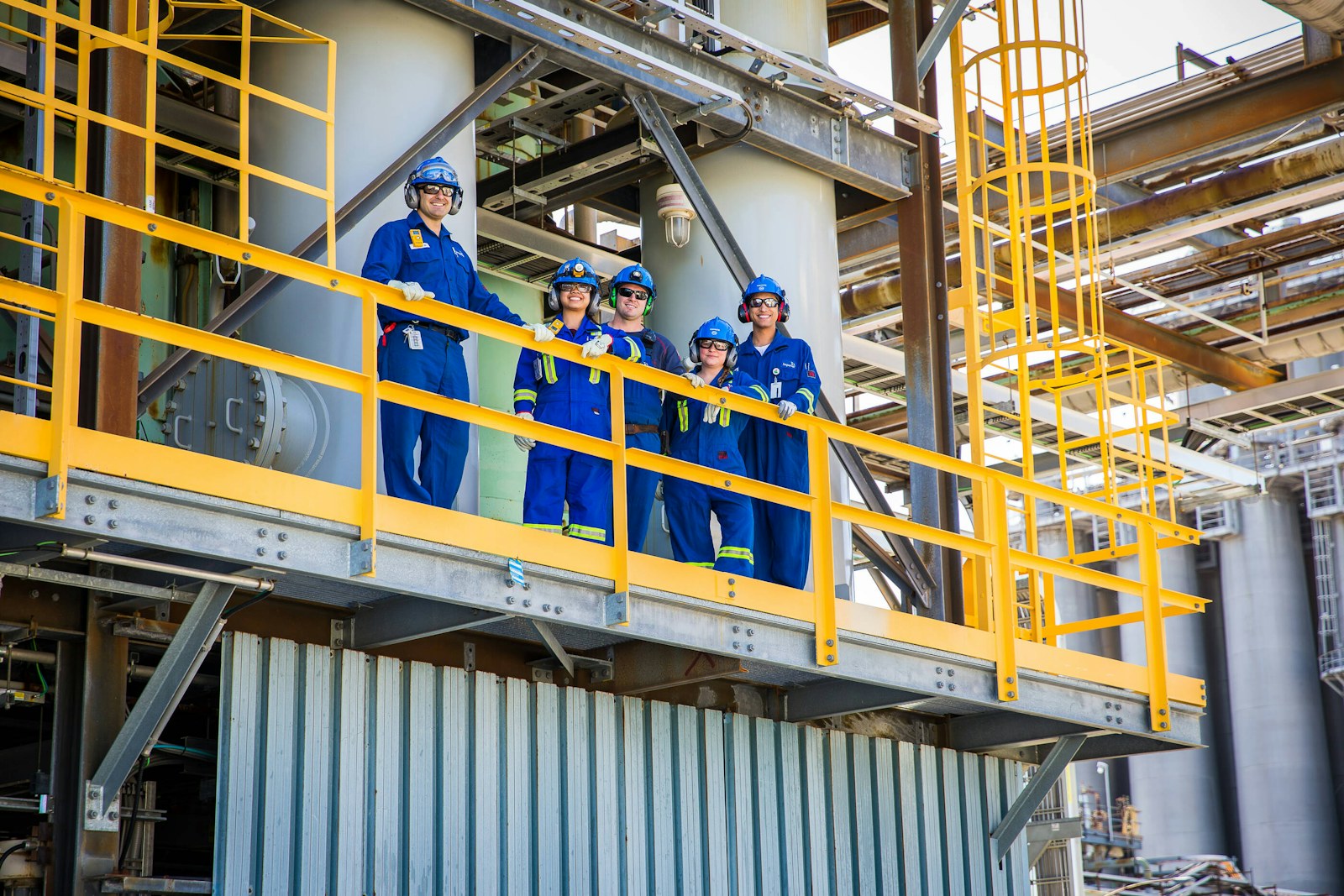 Plant team on an industrial platform, the setting for Lean Six Sigma Oshawa training