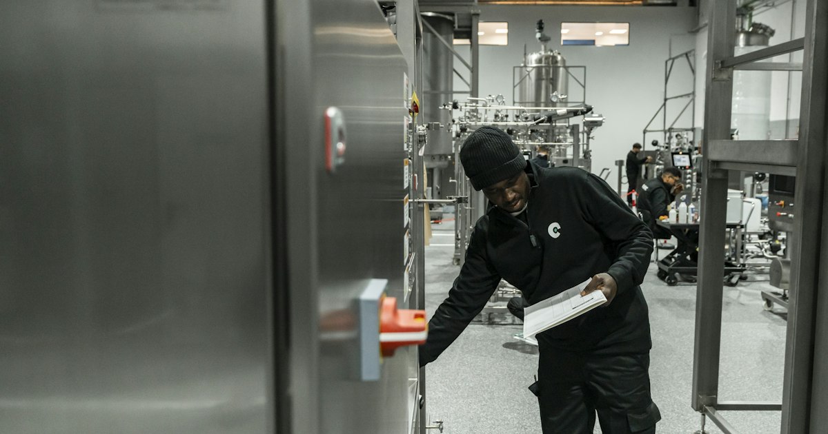Technician checking equipment against a checklist, part of ISO 9001 training Durham Region plants need